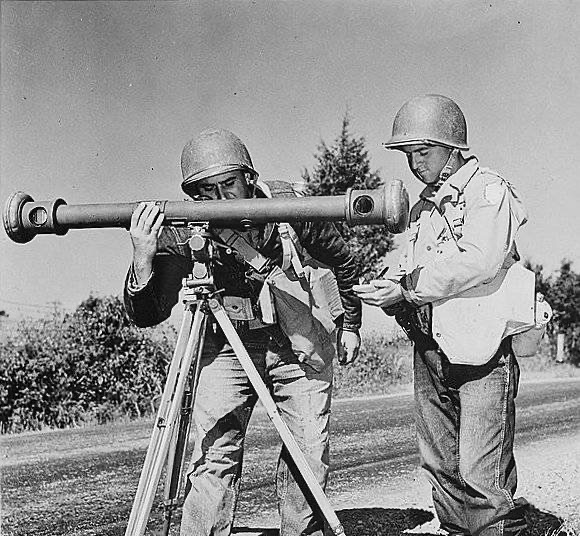 American soldiers using a rangefinder during army maneuvers in the 1940s